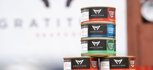 Cans of Gratitude Canned Fish stacked on top of each other